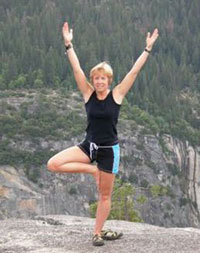 Pamela practices a yoga pose